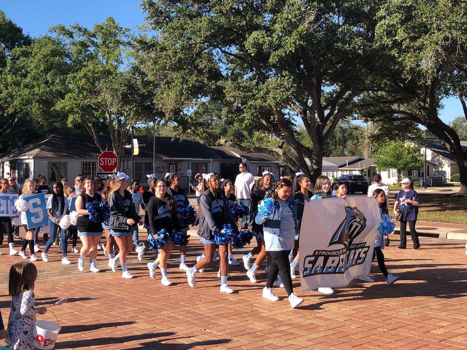 The Stockdick Junior High cheerleaders march during the parade.